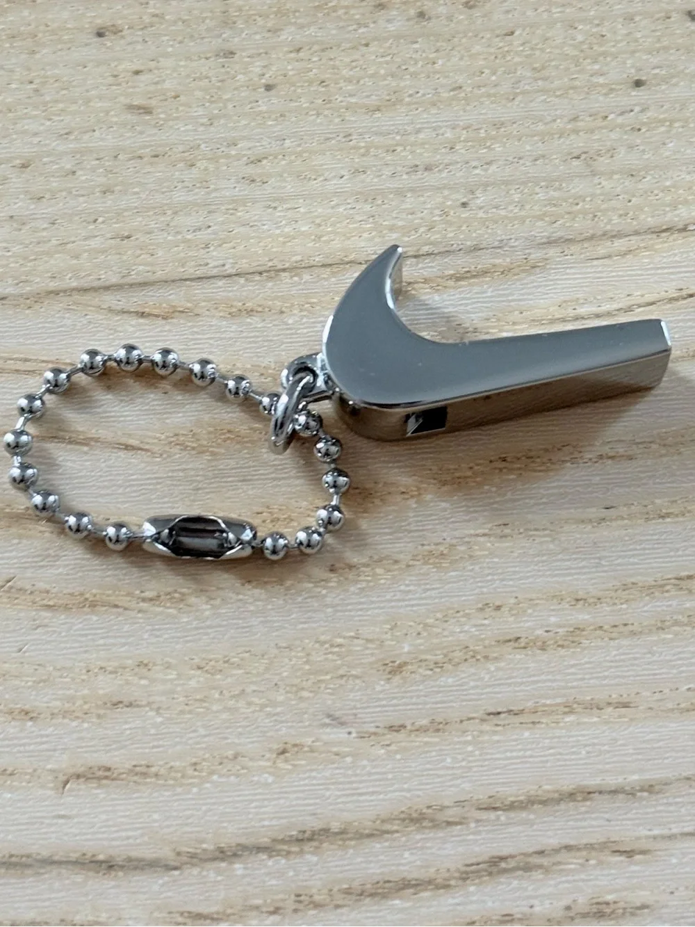 Nike Silver Swoosh Whistle Keychain